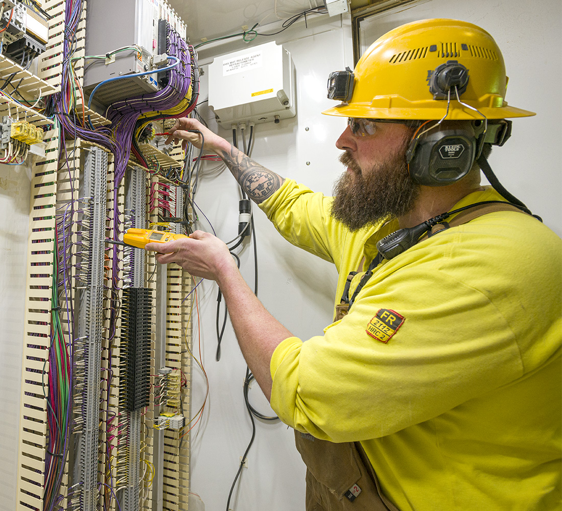Collins core values, do the right thing, sustainable forestry, electrician at work